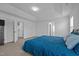 Main bedroom with carpet, neutral walls, walk-in closet and views to the main bath at 7205 Tillage Rd, Mebane, NC 27302