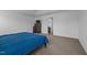 A carpeted main bedroom featuring a trey ceiling and access to the main bathroom at 7205 Tillage Rd, Mebane, NC 27302