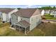 The back of the home features a screened-in porch and well-kept lawn at 7205 Tillage Rd, Mebane, NC 27302