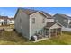 View of the back of the house, featuring a nice lawn and screened in porch at 7205 Tillage Rd, Mebane, NC 27302