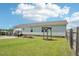 Expansive backyard featuring a wooden pergola, grill and an abundance of space for outdoor activities at 7228 Lowery Meadow Dr, Wendell, NC 27591