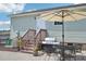 Backyard featuring an outdoor dining set and grill, ideal for entertaining and relaxation at 7228 Lowery Meadow Dr, Wendell, NC 27591