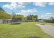Large, fenced backyard featuring a trampoline and a shed, offering ample space for recreation and storage at 7228 Lowery Meadow Dr, Wendell, NC 27591