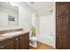 Bathroom showcasing a single sink vanity, toilet, and a combined shower and bathtub at 7228 Lowery Meadow Dr, Wendell, NC 27591