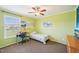 Cozy bedroom with green walls, a ceiling fan, and desk, creating a personalized space at 7228 Lowery Meadow Dr, Wendell, NC 27591