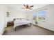 Bedroom features a ceiling fan, natural light, and neutral carpet, creating a cozy and inviting atmosphere at 7228 Lowery Meadow Dr, Wendell, NC 27591