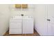 Laundry room featuring a side-by-side washer and dryer setup with overhead storage at 7228 Lowery Meadow Dr, Wendell, NC 27591