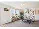 Cozy living room filled with natural light from large windows and inviting decor at 7228 Lowery Meadow Dr, Wendell, NC 27591