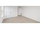 Bedroom featuring carpet floors, neutral walls, a double door closet and an open entry way at 75 Rosewood Ln, Youngsville, NC 27596