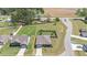 Expansive aerial view of a home with manicured lawn, fenced backyard, and attached two-car garage at 8 Pal Ct, Benson, NC 27504