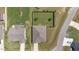 Straight down aerial view displaying a home's roof, driveway, and surrounding lawn and landscaping at 8 Pal Ct, Benson, NC 27504