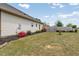 View of the backyard featuring lush lawn and partial fencing offering privacy at 8 Pal Ct, Benson, NC 27504