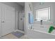 Bathroom featuring a soaking tub, separate shower, and a window that provides natural light at 8 Pal Ct, Benson, NC 27504