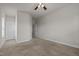 Neutral bedroom with plush carpet, ceiling fan, and minimalist design at 8 Pal Ct, Benson, NC 27504