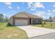 Charming single-Gathering home featuring a brick facade, attached garage, and landscaped front yard at 8 Pal Ct, Benson, NC 27504