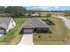 Attractive single-story brick home with a well-kept lawn and attached two-car garage at 8 Pal Ct, Benson, NC 27504