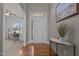 Inviting foyer with hardwood floors, transom windows, and front door, welcoming guests at 8 Pal Ct, Benson, NC 27504