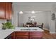Gourmet kitchen with stainless steel appliances, quartz countertops, and views to dining area at 8 Pal Ct, Benson, NC 27504