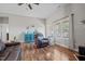 Well-lit living room with hardwood floors, a comfortable armchair and a neutral color scheme at 8 Pal Ct, Benson, NC 27504