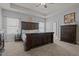 Spacious main bedroom featuring large bed, ceiling fan, and ensuite bath at 8 Pal Ct, Benson, NC 27504
