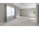 Spacious bedroom with neutral walls, carpet, and large windows for plenty of natural light at 8005 Somerdale Dr, Durham, NC 27713