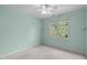 Neutral bedroom with carpet, large window with backyard views, and ceiling fan with light at 8005 Somerdale Dr, Durham, NC 27713
