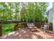 Cozy deck with outdoor seating, perfect for enjoying a sunny day in the backyard at 8005 Somerdale Dr, Durham, NC 27713