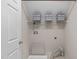 Unfinished laundry room with washer and dryer hookups, sink, shelving for storage, and access door at 8005 Somerdale Dr, Durham, NC 27713