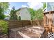 Backyard featuring raised garden beds, a wooden fence, and a grassy area at 8005 Somerdale Dr, Durham, NC 27713