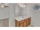 Bathroom featuring a vanity with cabinet storage and a decorative round window at 8022 Hogan Dr, Wake Forest, NC 27587