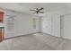 Bedroom features a ceiling fan, closet, and built-in storage at 8022 Hogan Dr, Wake Forest, NC 27587