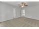 Large bedroom features a ceiling fan and views to the hallway and second floor at 8022 Hogan Dr, Wake Forest, NC 27587