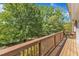 This is an image of the outdoor deck with beautiful green trees in the background at 8022 Hogan Dr, Wake Forest, NC 27587