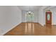Bright dining room with hardwood floors, a bay window, and a chandelier at 8022 Hogan Dr, Wake Forest, NC 27587