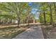 Secluded home on a sprawling lot with mature trees and a private driveway at 8022 Hogan Dr, Wake Forest, NC 27587