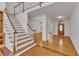 Grand foyer with hardwood floors, a staircase, and a clear view to the dining room at 8022 Hogan Dr, Wake Forest, NC 27587