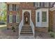 Charming brick home with a welcoming front entrance and beautiful landscaping at 8022 Hogan Dr, Wake Forest, NC 27587