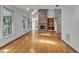 Spacious living room featuring a vaulted ceiling, fireplace, skylights, and hardwood floors throughout at 8022 Hogan Dr, Wake Forest, NC 27587