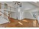 Open living room featuring a staircase, hardwood floors, and vaulted ceilings for a bright and airy feel at 8022 Hogan Dr, Wake Forest, NC 27587