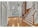 Bright living room featuring a brick fireplace, skylights, and hardwood floors for a cozy feel at 8022 Hogan Dr, Wake Forest, NC 27587