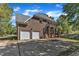 A home with a two-car garage, rear balcony, and a beautiful, wooded backyard at 8022 Hogan Dr, Wake Forest, NC 27587