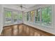 Sunroom with hardwood flooring and outdoor view at 8022 Hogan Dr, Wake Forest, NC 27587