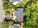 Aerial view of the house showcasing the roof, driveway, and surrounding trees at 8212 Duck Creek Dr, Raleigh, NC 27616