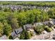 Overview of a residential area with well-maintained houses and mature trees creating a serene environment at 8212 Duck Creek Dr, Raleigh, NC 27616