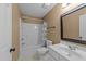 This bathroom features a tub with shower, a vanity with a sink, and a toilet at 8212 Duck Creek Dr, Raleigh, NC 27616