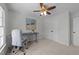 Bright bedroom with desk, chair, and double door closet at 8212 Duck Creek Dr, Raleigh, NC 27616
