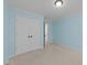 The bedroom has light-blue painted walls, neutral carpet, crown molding, and a closet with double doors at 8212 Duck Creek Dr, Raleigh, NC 27616