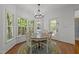 Cozy breakfast nook with a round table, surrounded by windows and natural light at 8212 Duck Creek Dr, Raleigh, NC 27616