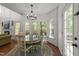 An eat-in kitchen nook with large windows overlooking trees and nature at 8212 Duck Creek Dr, Raleigh, NC 27616