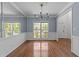 Formal dining room with hardwood floors and a chandelier at 8212 Duck Creek Dr, Raleigh, NC 27616